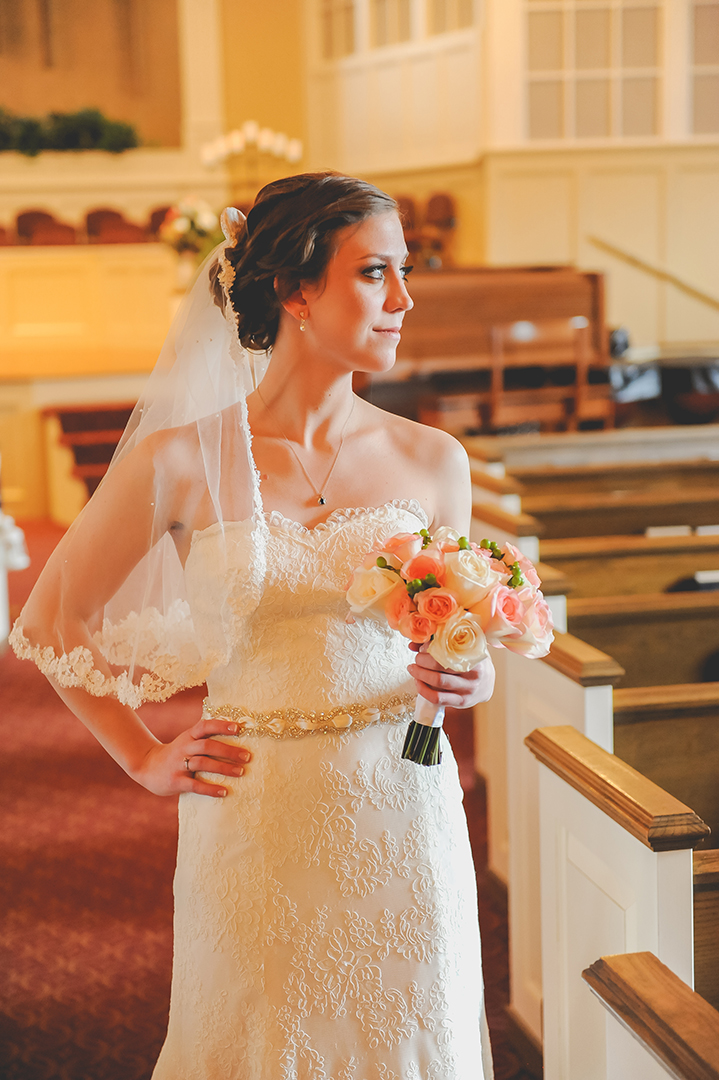 bride holding her bouquet at her family church