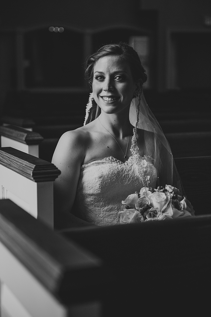 a beautiful bride sitting in a church before her wedding ceremony