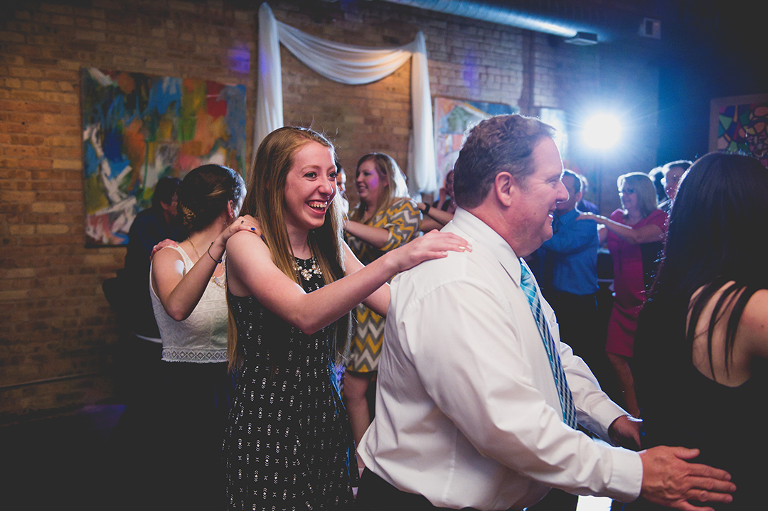 A girl laughing at a Chicago wedding reception at the Mars Gallery.