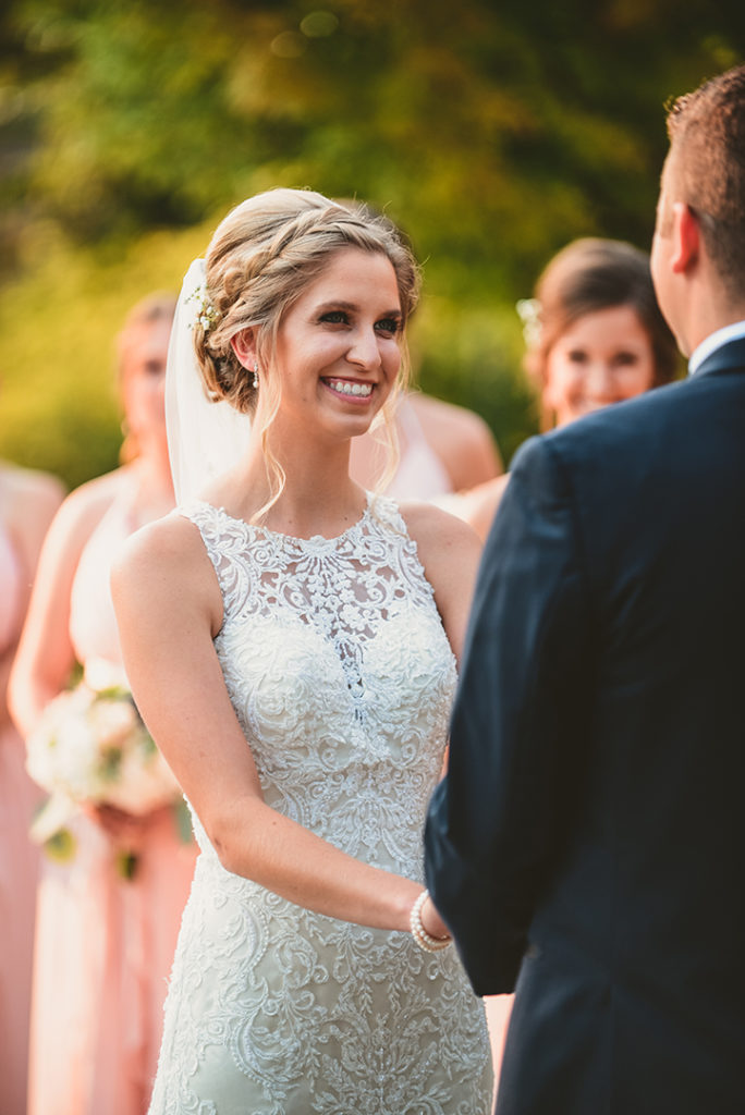 A bride looks at her groom during their wedding in Naperville.