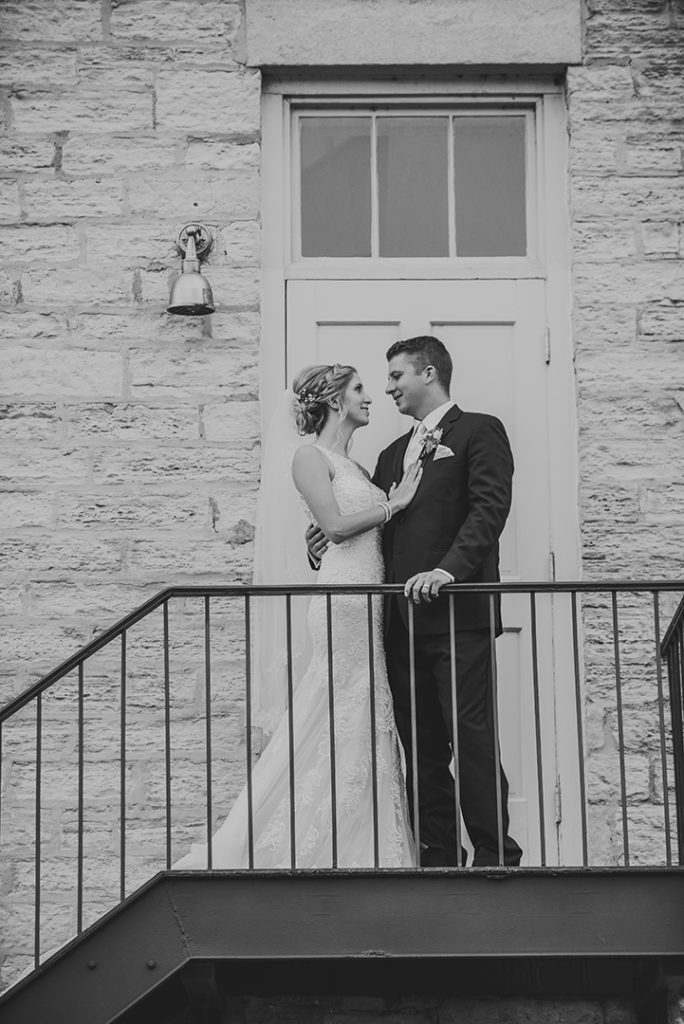 A bride touching her husbands heart at their Lockport wedding.