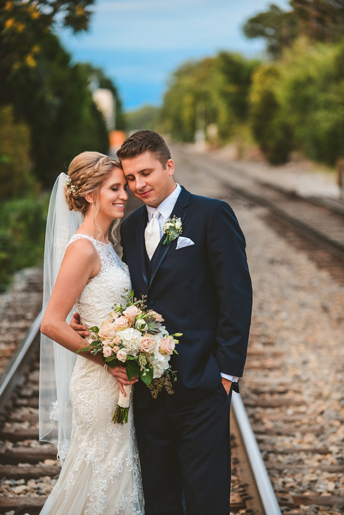 A bride and groom in a warm embrace at their Plainfield wedding.