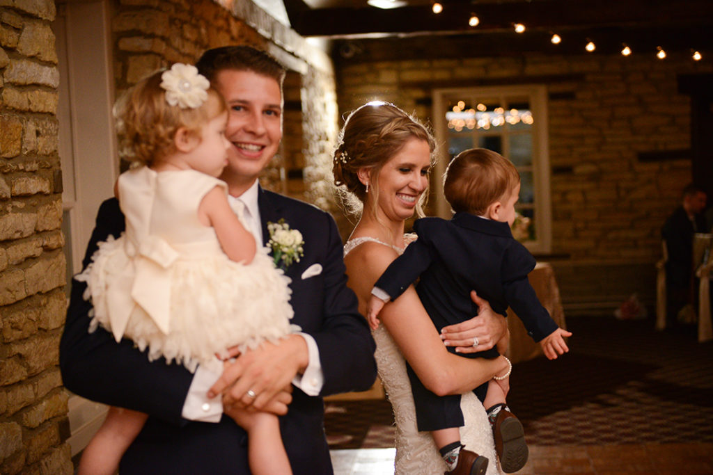 A bride and groom dancing with their kids and a wedding in Naperville Illinois.