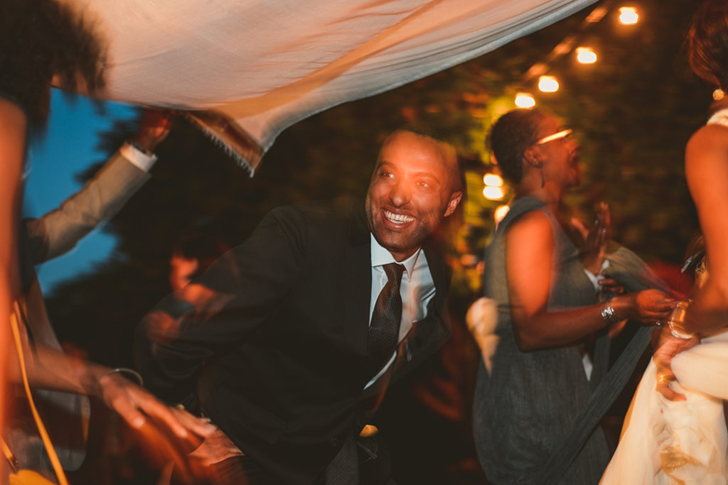 a man dancing in the evening at a Chaney Mansion Wedding