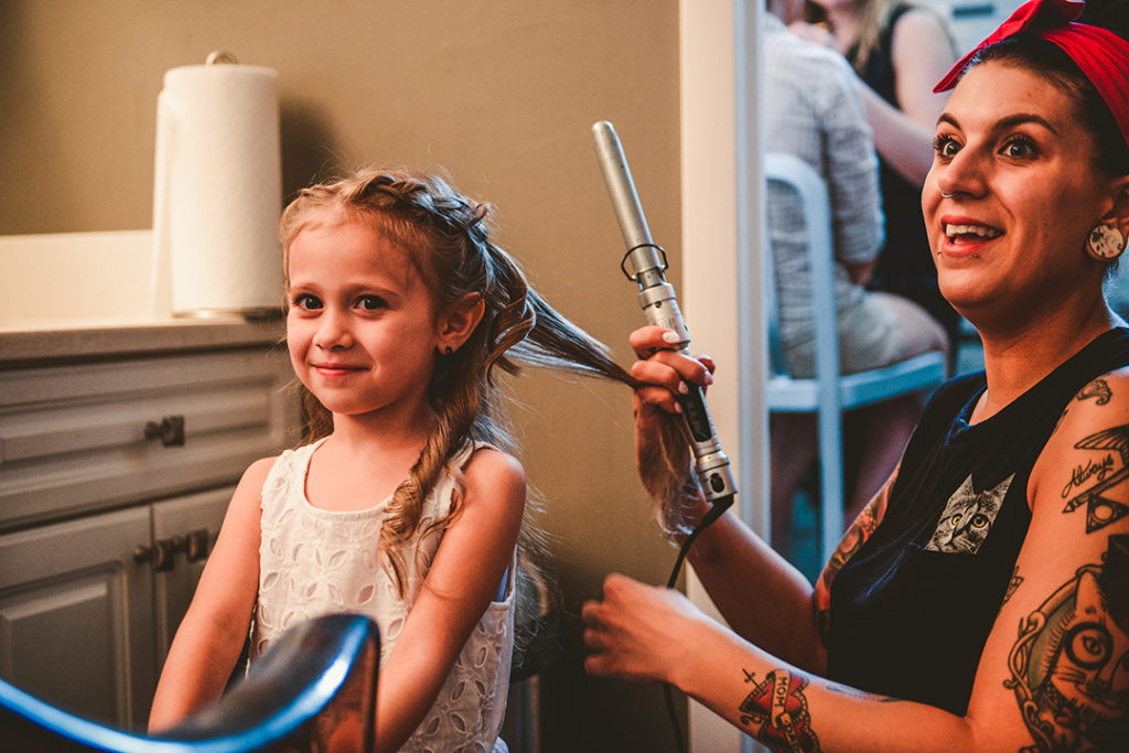 Little girl getting her hair done at a Pittsburg Pennsylvania wedding