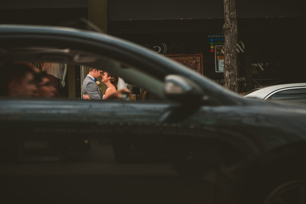 bride and groom hugging through a car window in Elmhurst