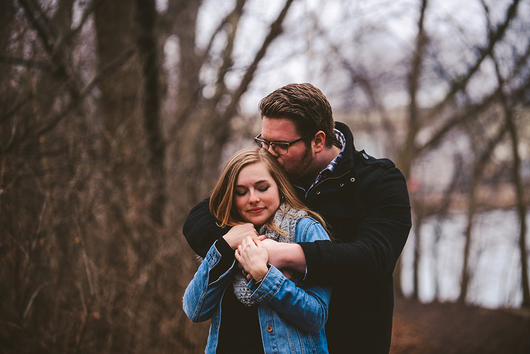 a husband hugging his wife from behind in Wheaton