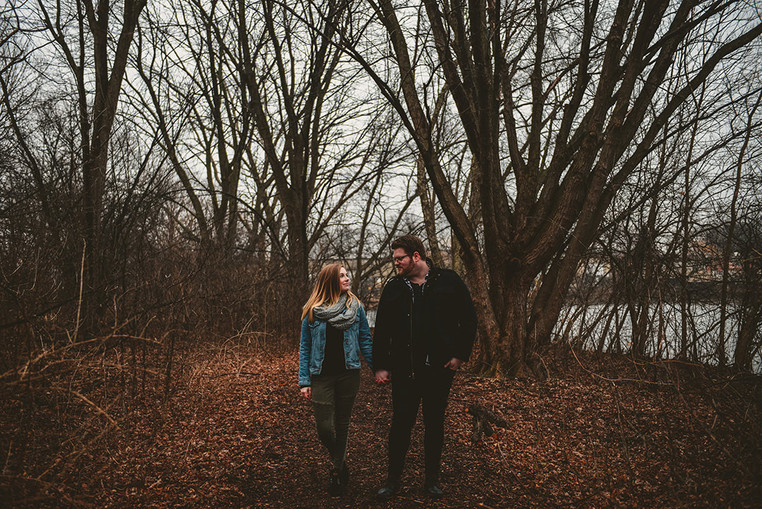 a married couple standing in the woods in the evening in Wheaton