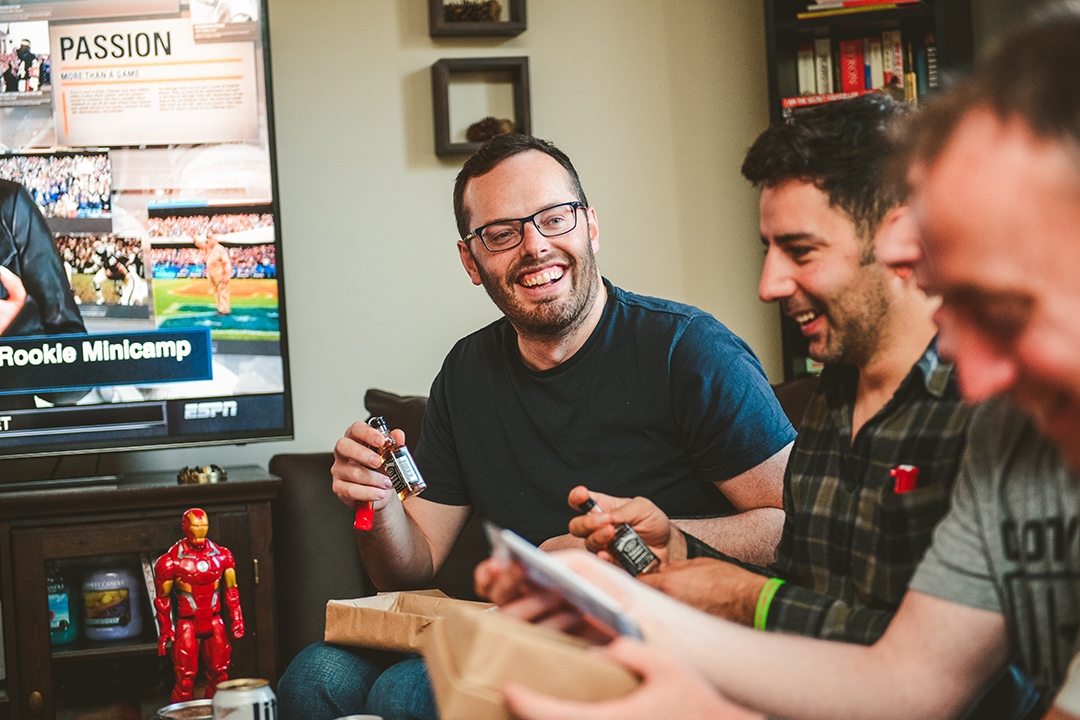 groomsmen opening gift from groom