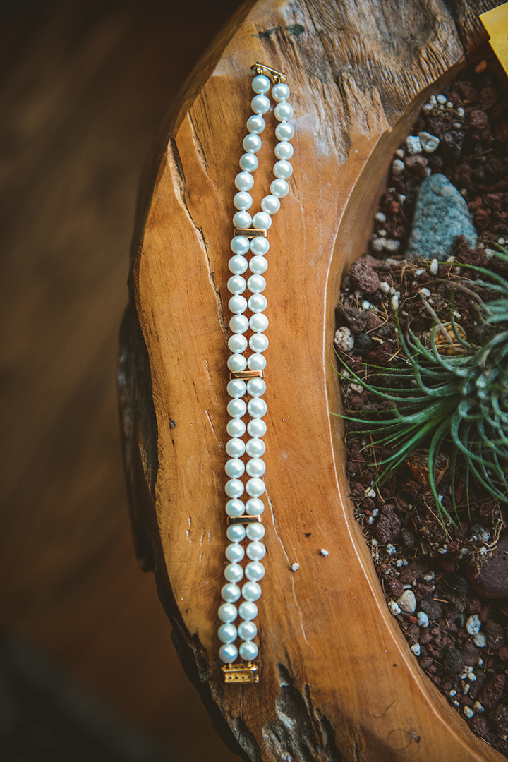 the brides pearl bracelet on wooden table