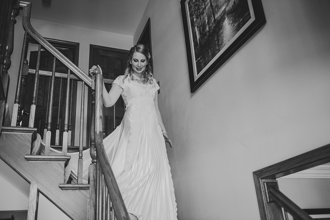 the bride coming down the stairs