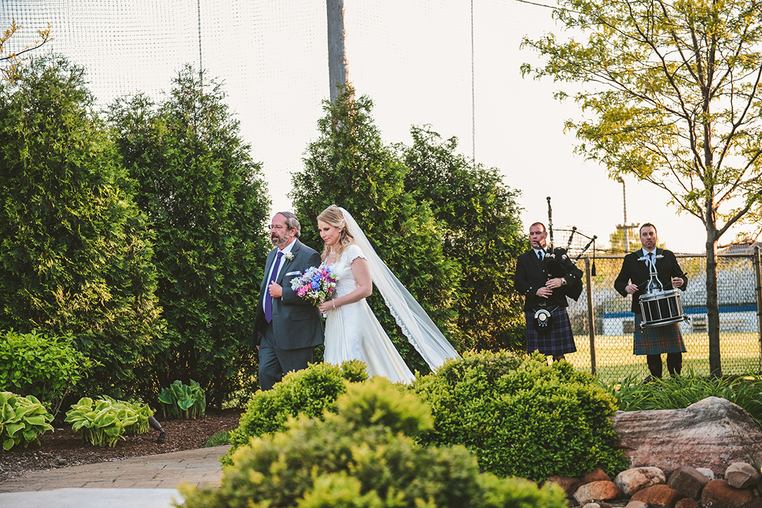 the bride walking with her father down the aisle