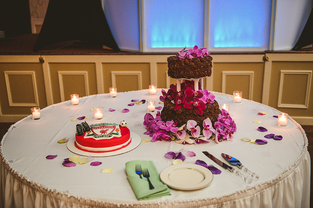 the wedding cake with a special soccer cake for the groom