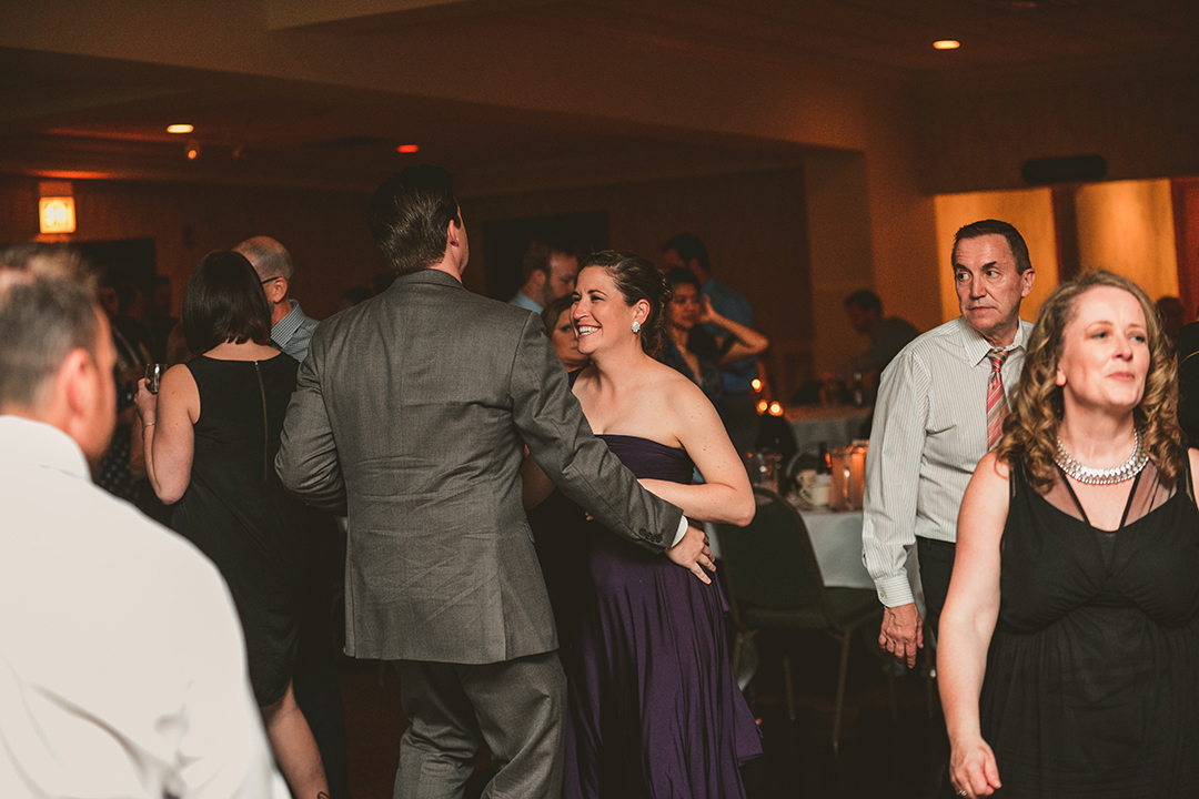 a woman laughing at a wedding reception at Gaelic Park