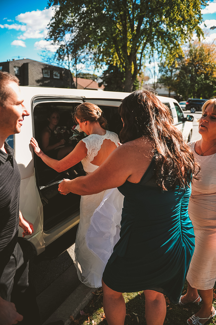 a bride getting into her limo on her wedding day in Joliet