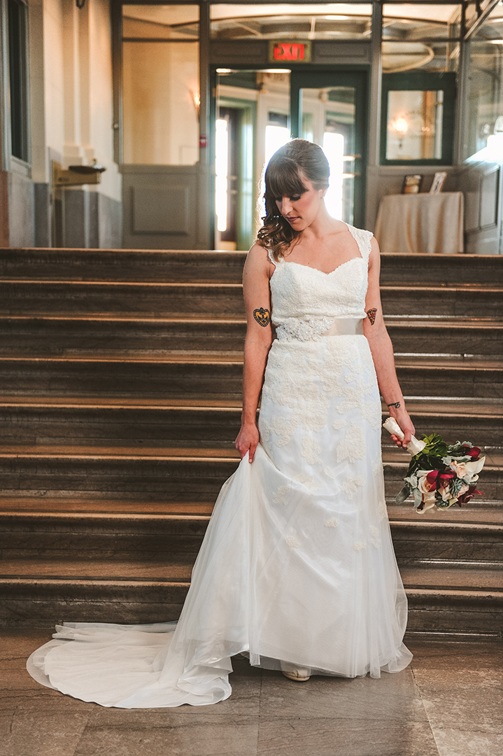 a bride adjusting her dress at the Joliet Union Station