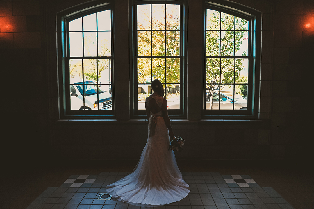 a bride looking out the window at the Joliet Union Station