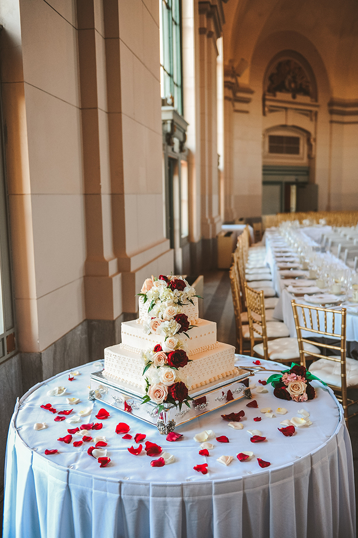 a beautiful wedding cake with live flowers at the Joliet Union Station