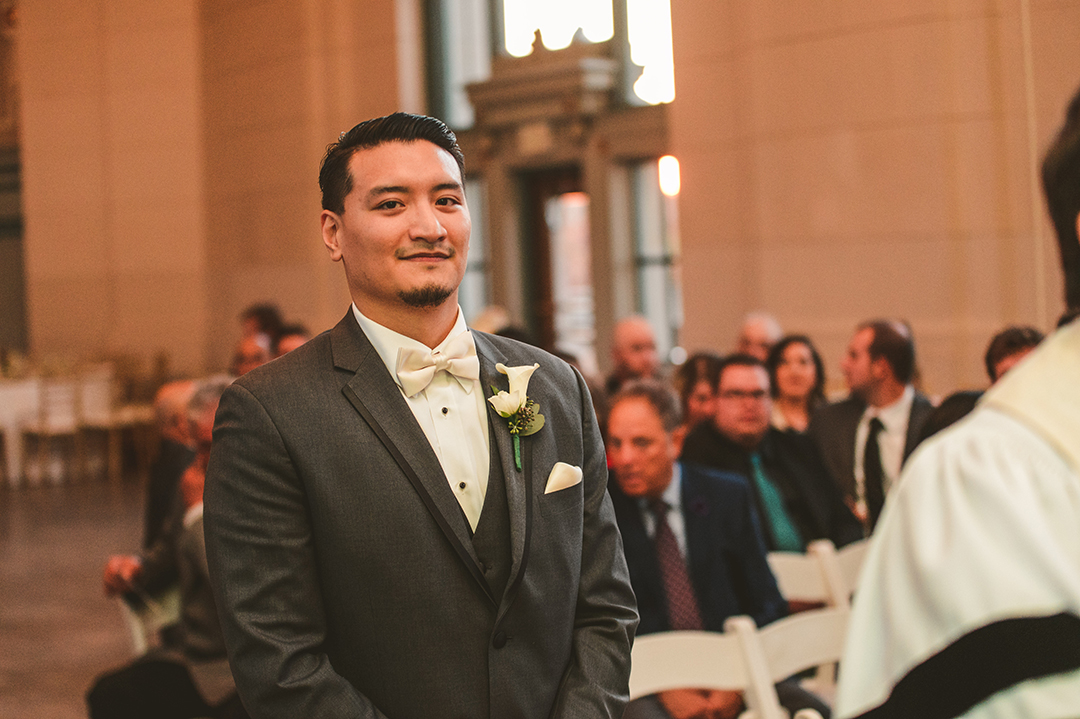 a groom walking down the aisle on his wedding day