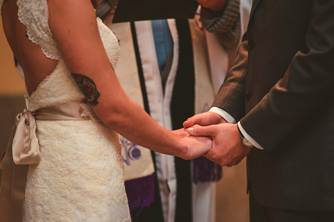 details of the groom holding his brides hand during a Joliet Union Station wedding