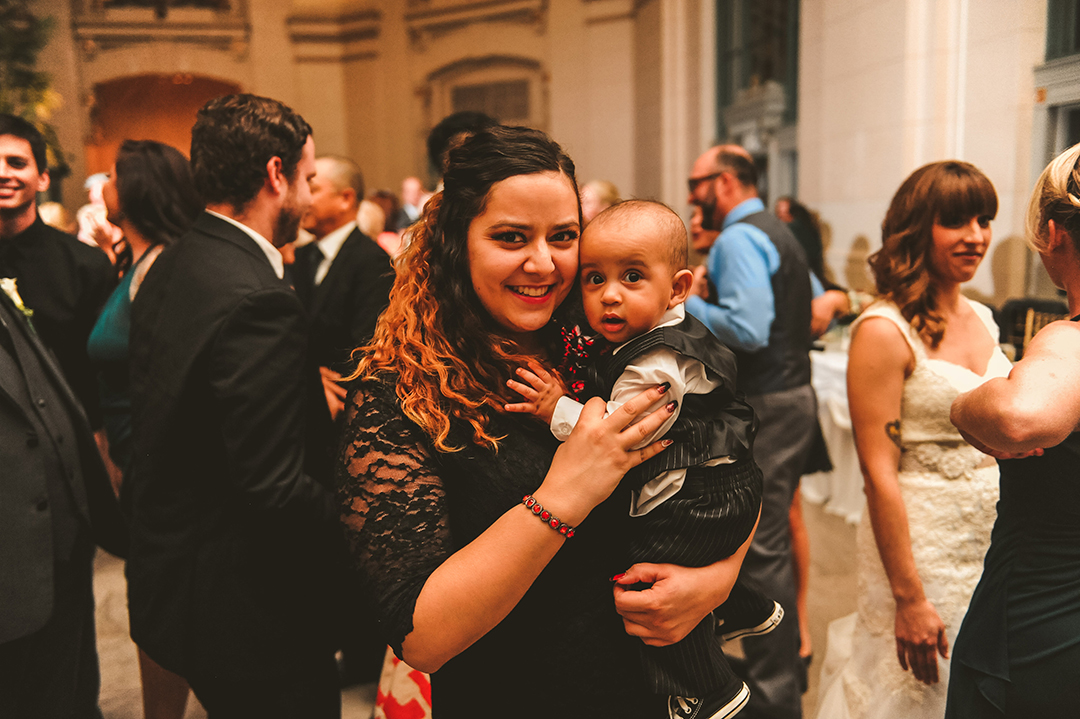 a mom holding her baby at a Joliet Union Station wedding