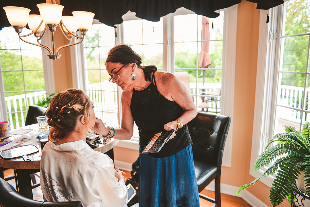 Kathy Feeney-Pilarcik applying a brides makeup in Oak Forest