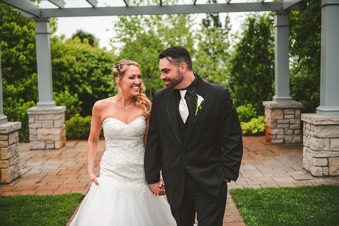 a bride and groom walking down the aisle at Gaelic Park in Oak Forest