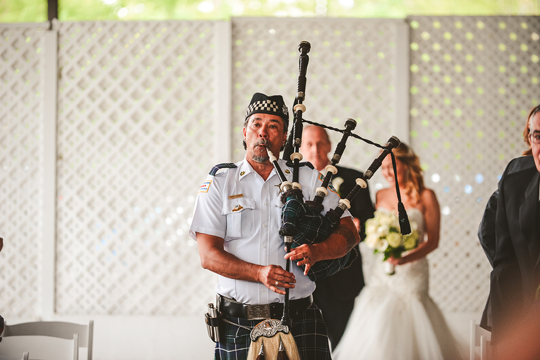 a bagpiper leading a bride down the aisle at Gaelic Park in Oak Forest