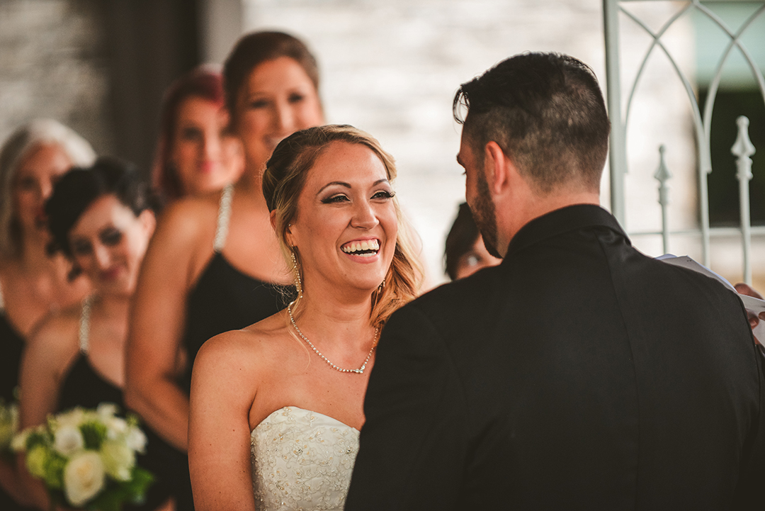 the bride laughing during her wedding ceremony