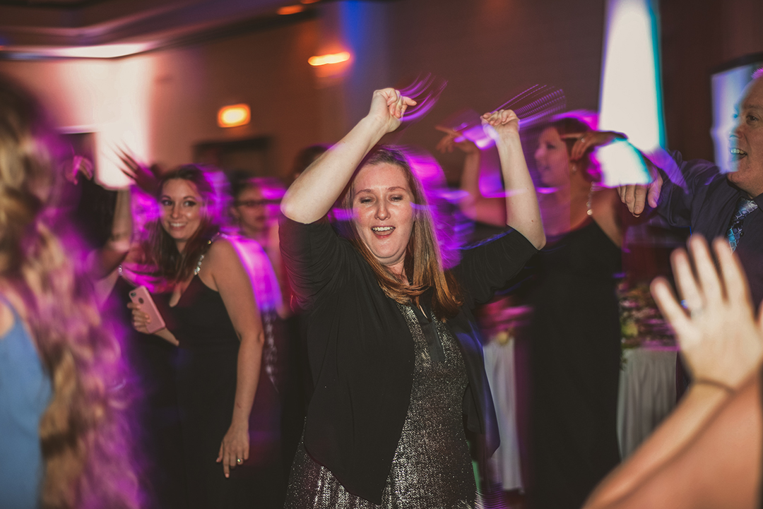 a shutter drag of a woman dancing at a wedding reception