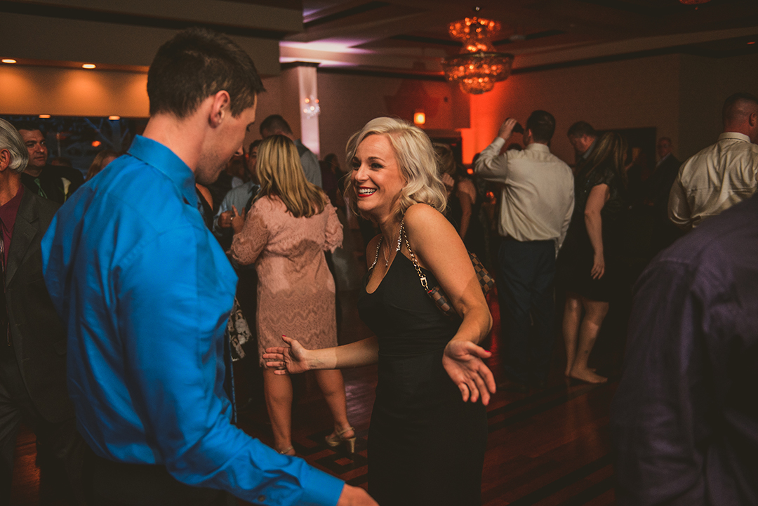 a bridesmaid dancing with her boyfriend at Gaelic Park