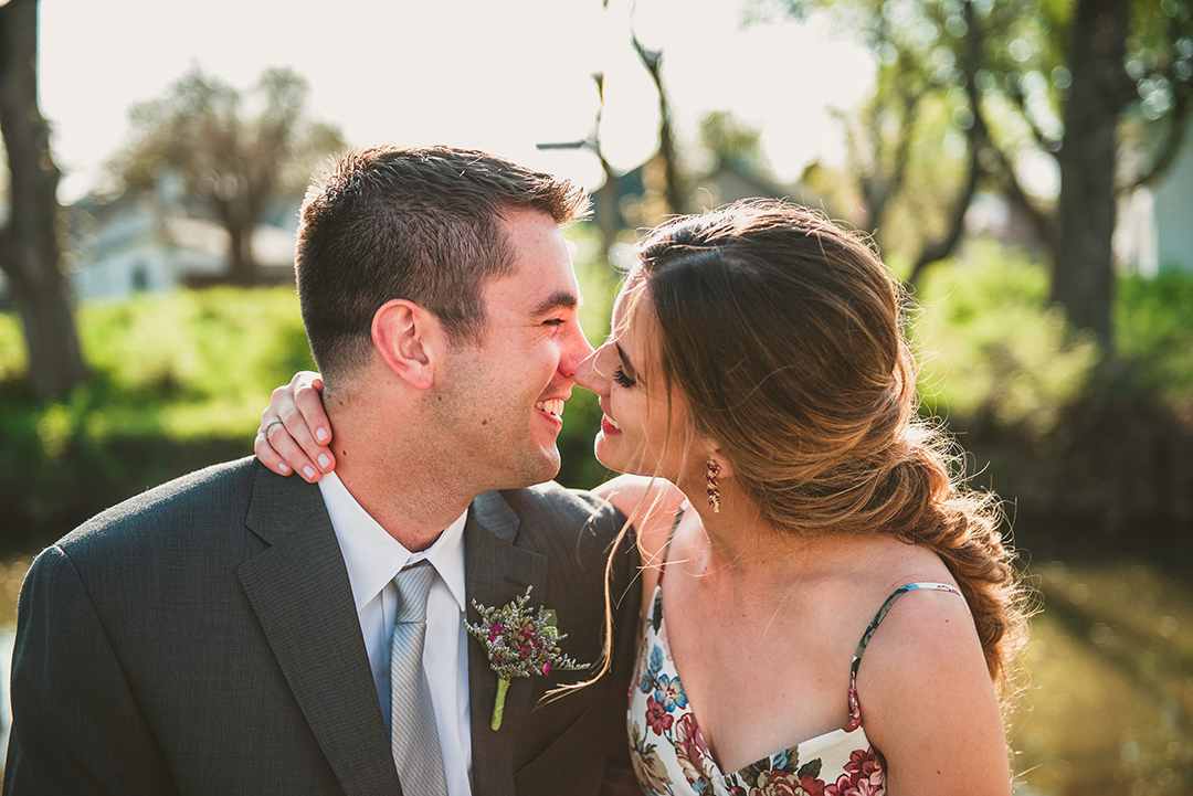a bride and groom sneaking a quick kiss before their Chicago elopement