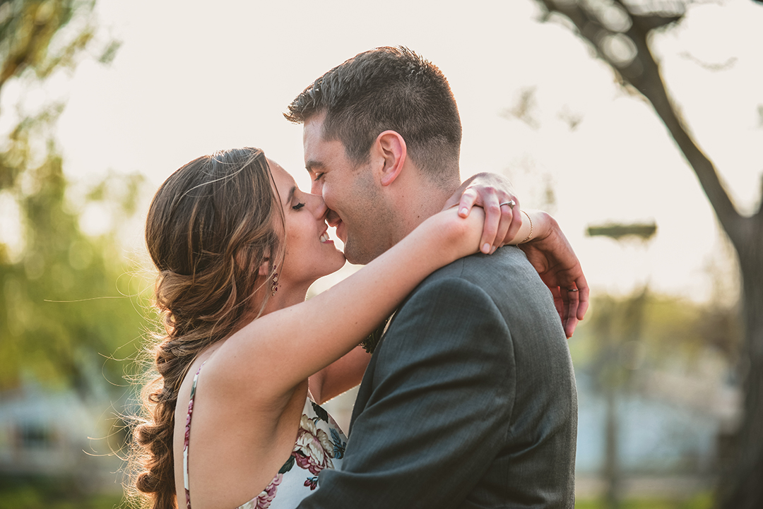 a bride and groom kissing as they smile at a Chicago elopement