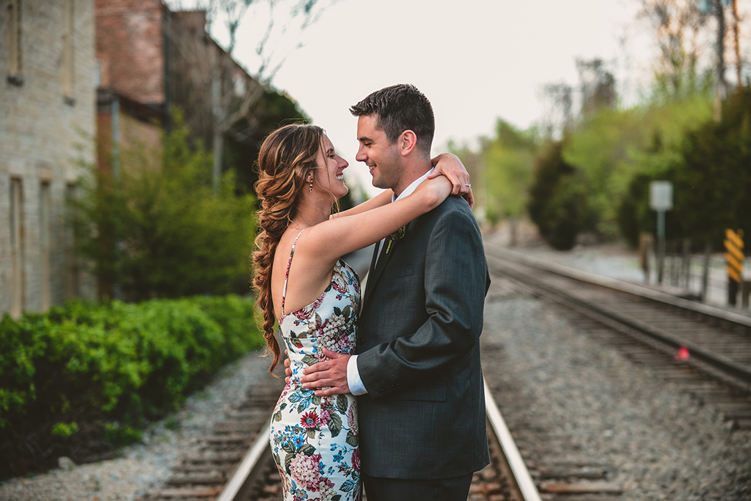 a newly married couple getting close for a kiss