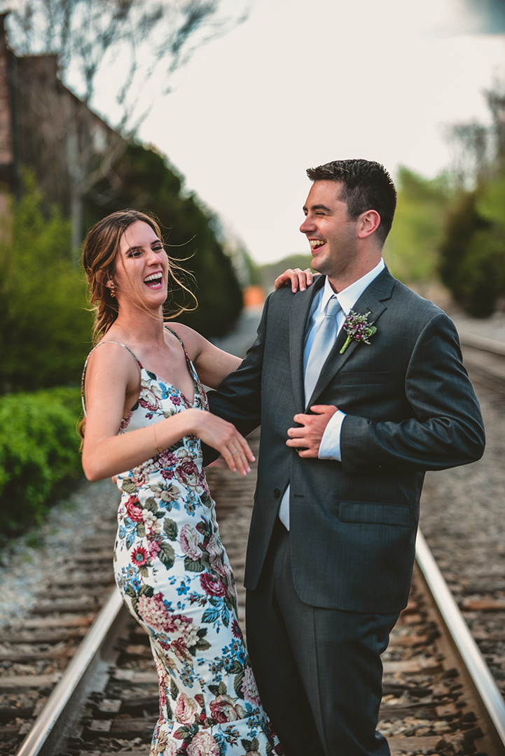 a bride and groom laughing in beautiful light