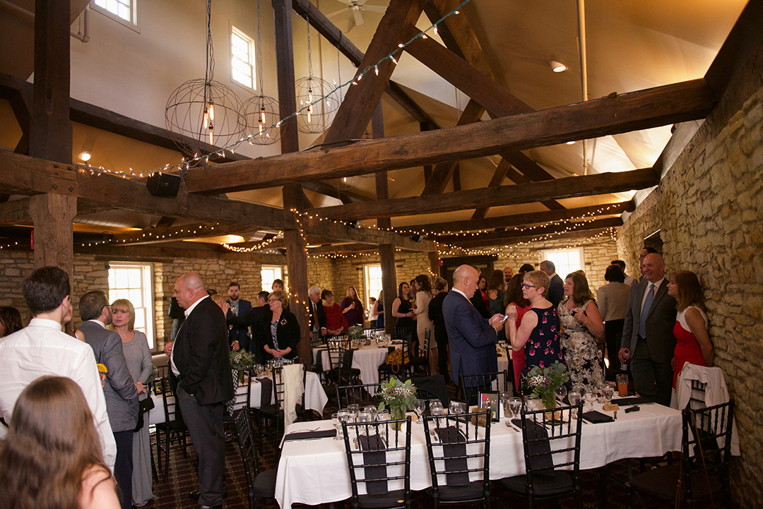 a wedding reception taking place at a rustic wedding venue