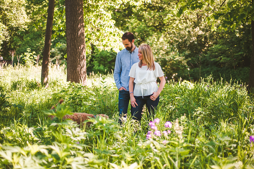 an outtake of a dog running into a photo at an engagement session