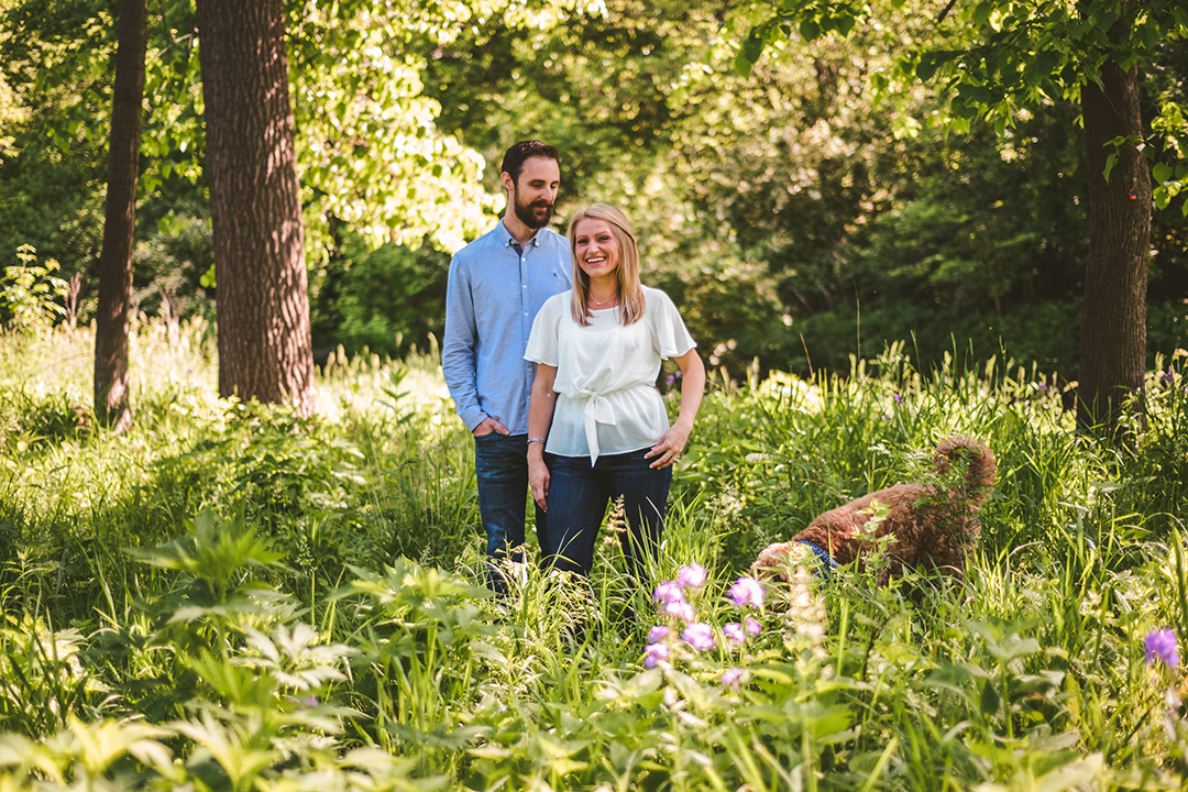 an outtake of a dog running through an engagement session