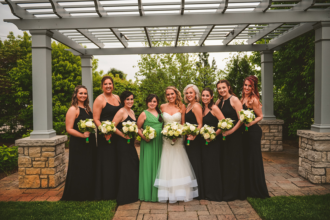 bridesmaids standing with their flowers at Gaelic Park