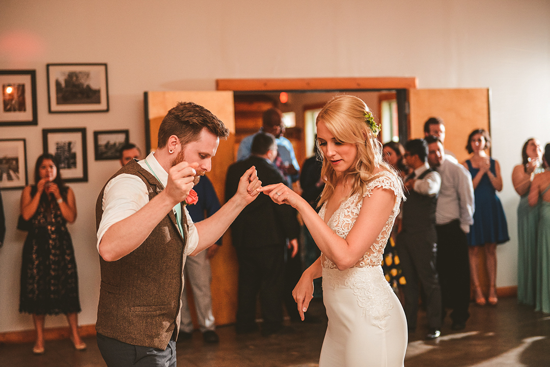 a husband and wife dancing during their first dance at the All Season Orchard in Woodstock IL