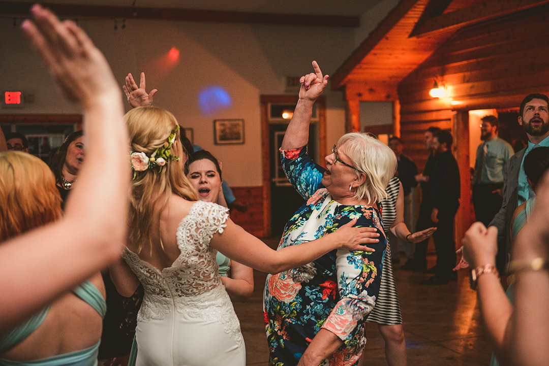 grandmother of bride dancing with a group at a wedding reception in Woodstock IL