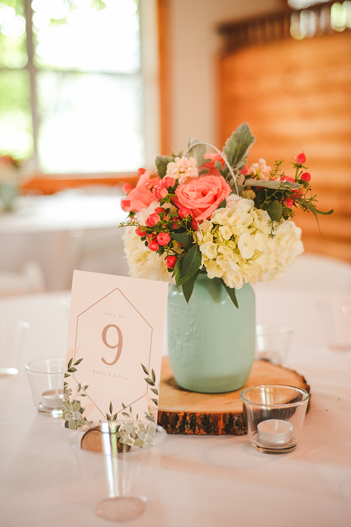 a bouquet of flowers on a table at a wedding reception in Woodstock IL