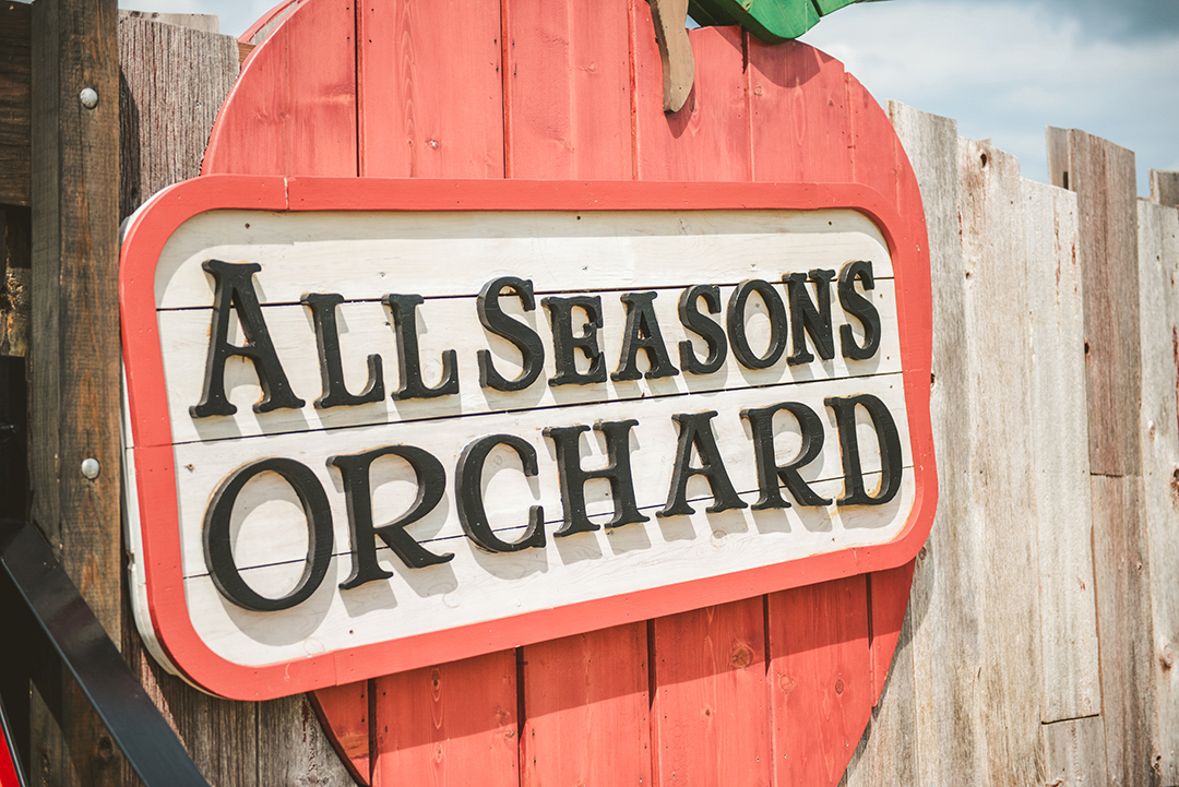 All Seasons Orchard sign on a wedding day