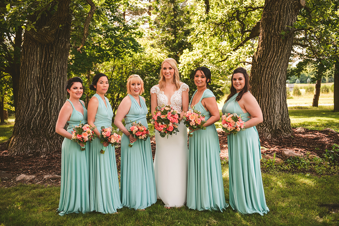 a bride laughing with her bridesmaids at the All Season Orchard in Woodstock