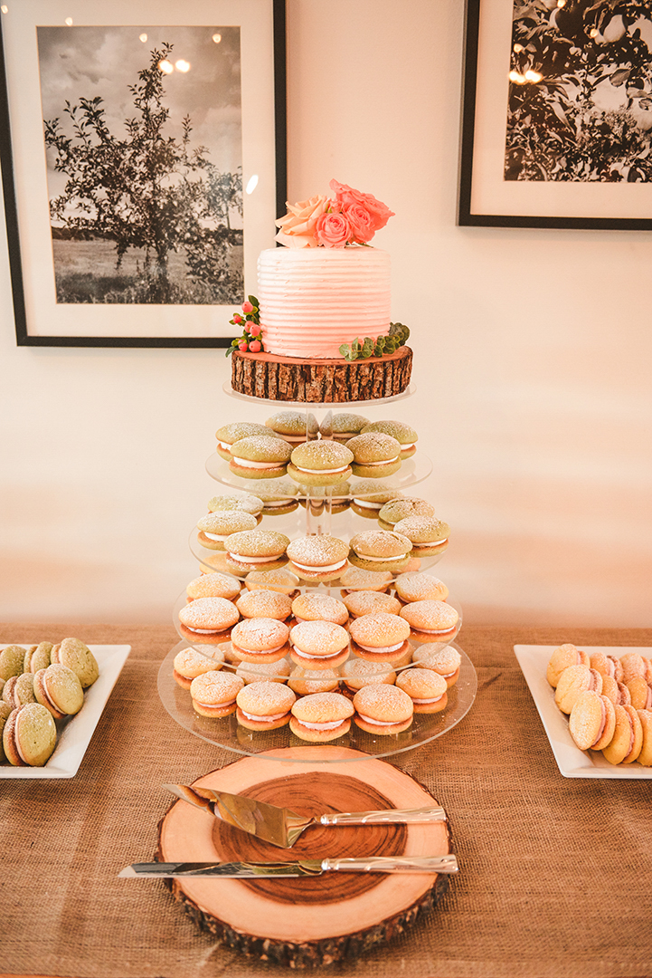 the wedding cake on a tower of sweets at a wedding reception in Woodstock IL