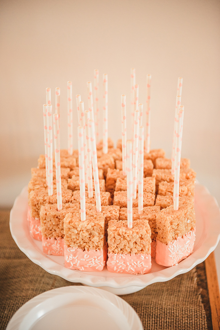 rice krispy treats on a stick at a wedding reception