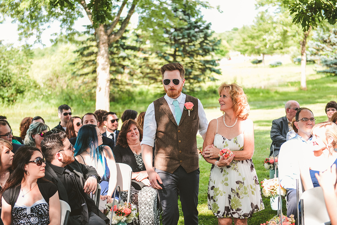 a groom walking his mother down the aisle at his wedding in Woodstock IL