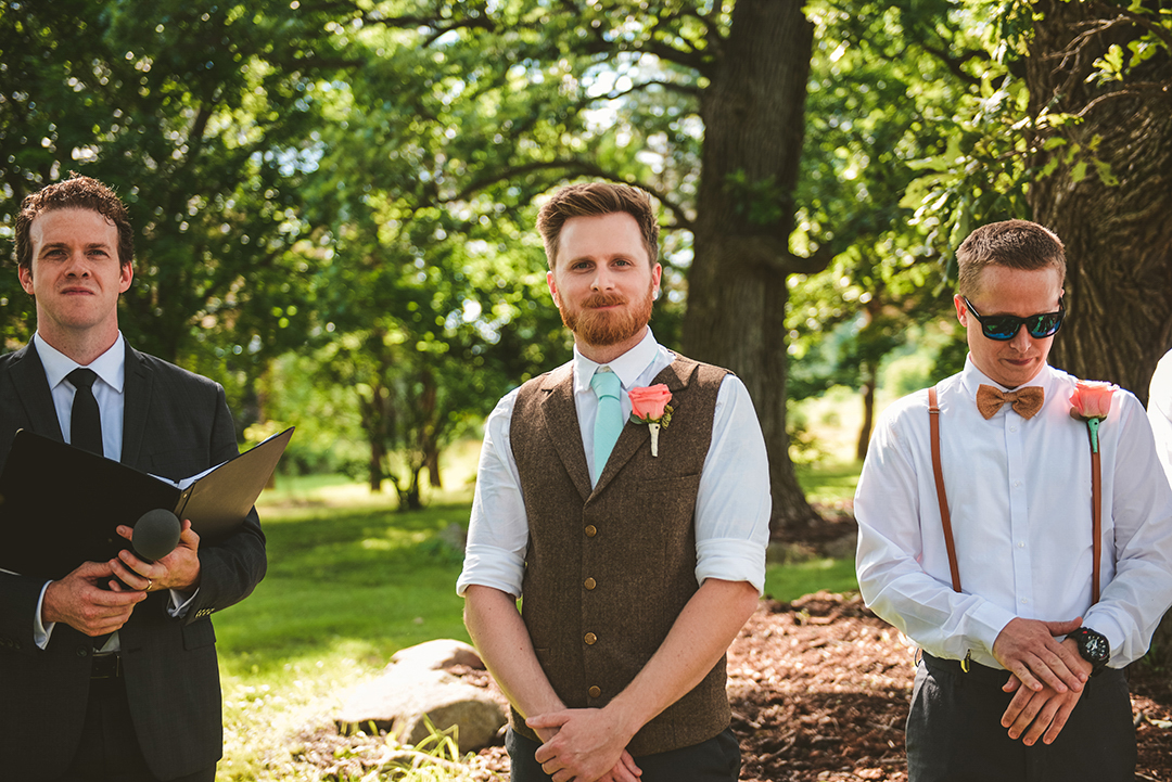 a groom watching his bride being walked down the aisle by her father in Woodstock IL