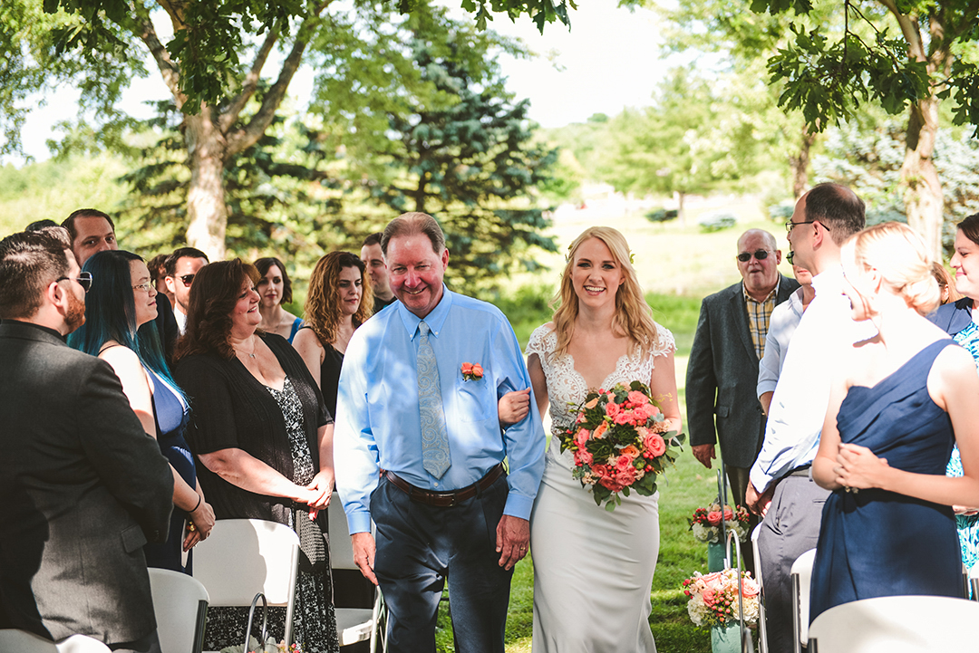 a father walking his daughter down the aisle at the All Season Orchard in Woodstock IL