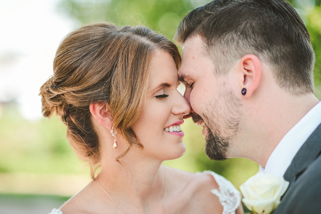 moments before a kiss of a bride and groom in the beautiful morning light